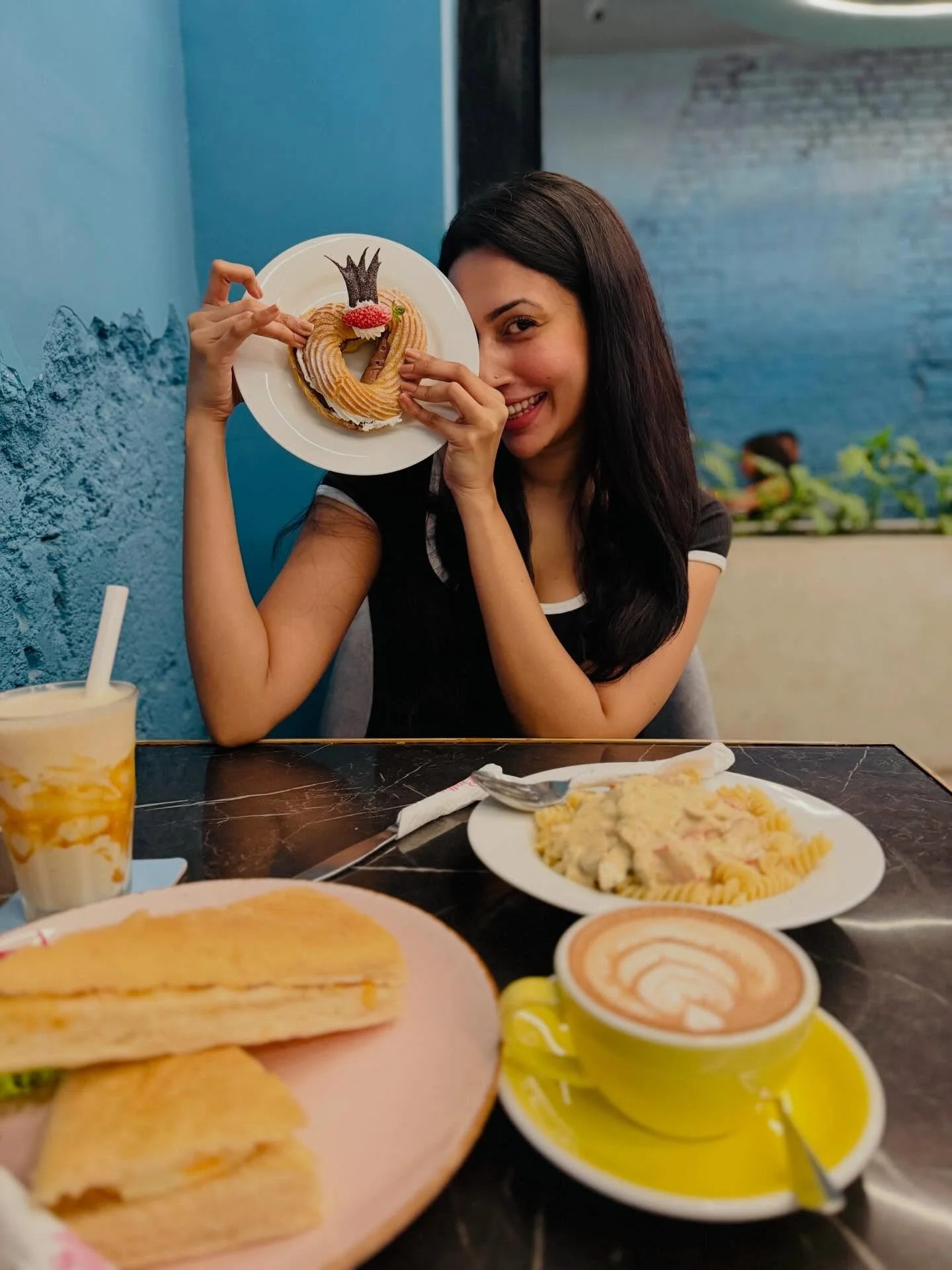 Photo by Amanda Silva on February 16, 2026. May be an image of coffee cup, coffee, toast, sandwich, cappuccino and text.