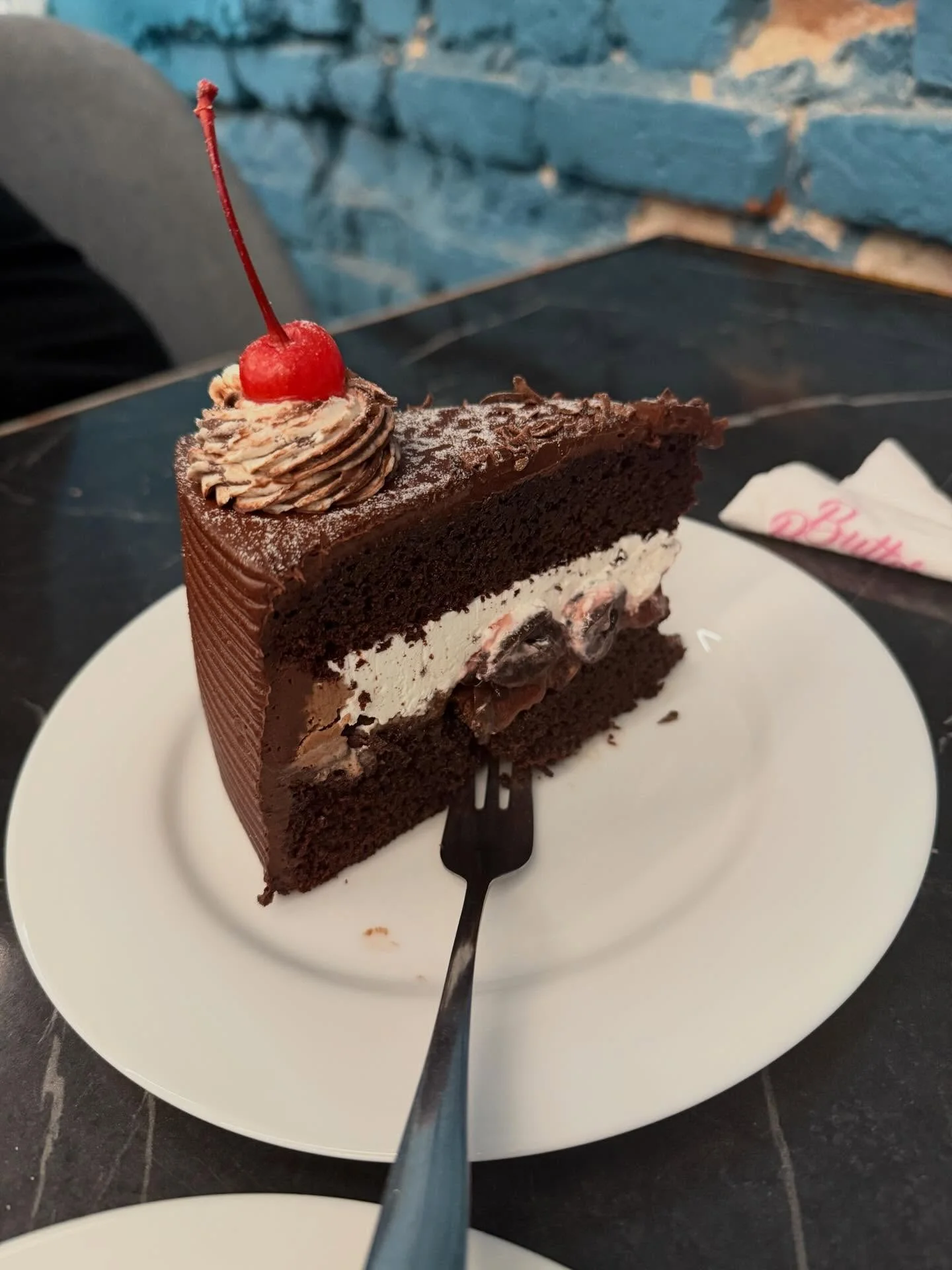 Photo by Amanda Silva on February 16, 2026. May be an image of cherries, chocolate mousse, chocolate cake and text.