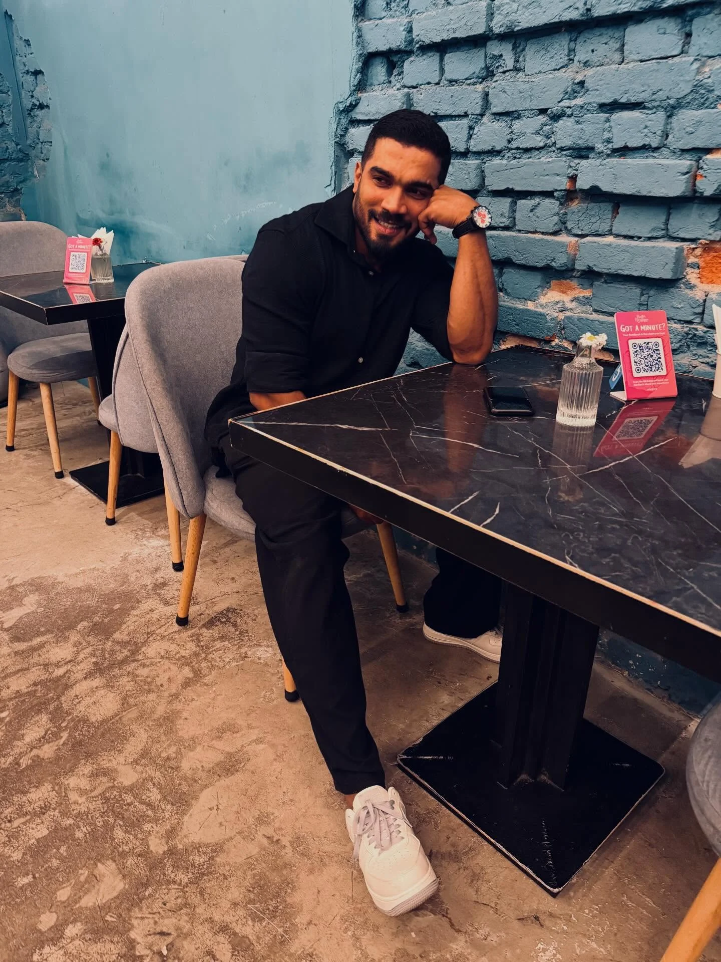 Photo by Amanda Silva on February 16, 2026. May be an image of one or more people, beard, people smoking, wingtip shoes, cigarette, cigar and text.