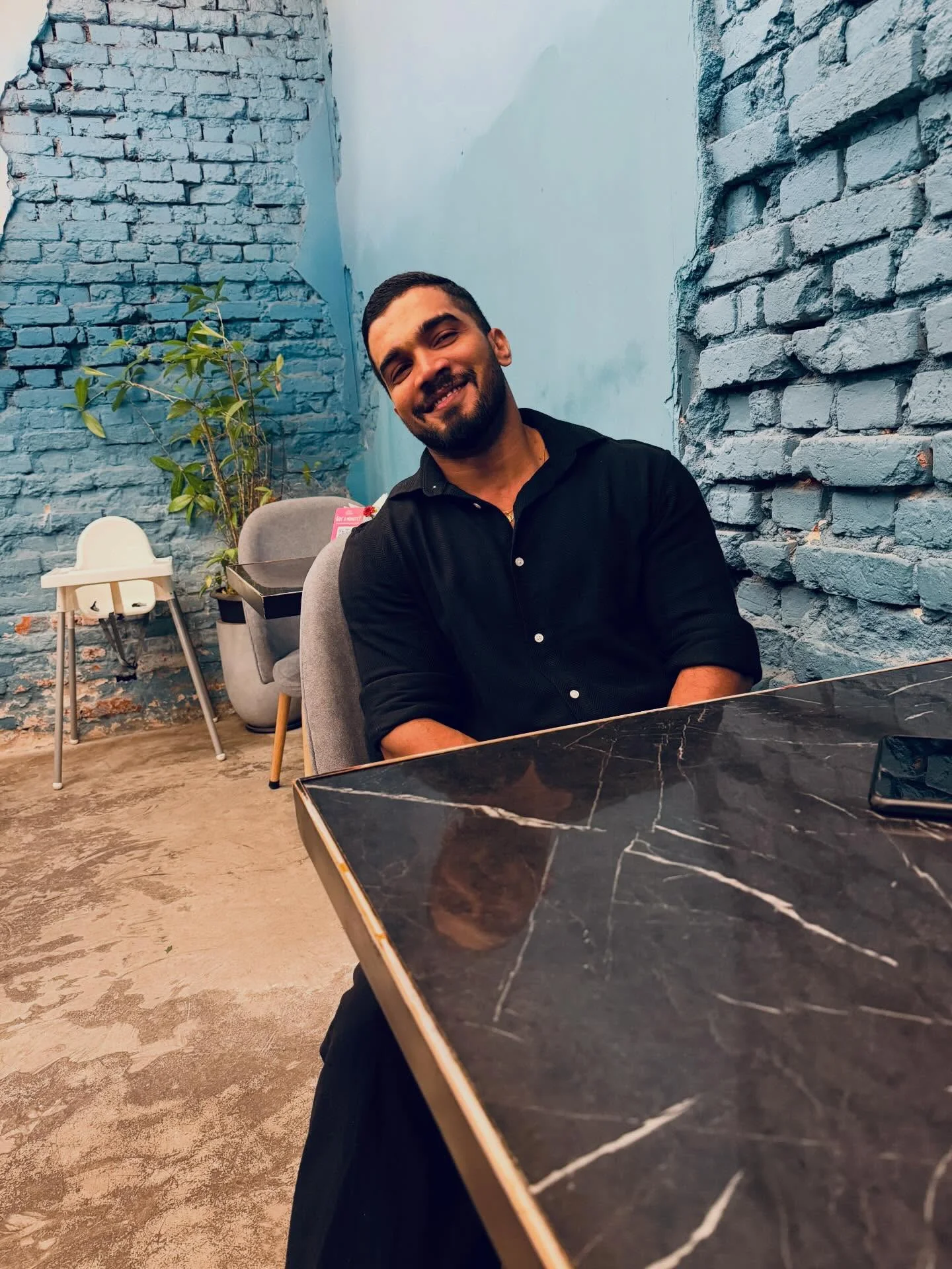 Photo by Amanda Silva on February 16, 2026. May be an image of one or more people, beard, people smiling, brick wall and text.