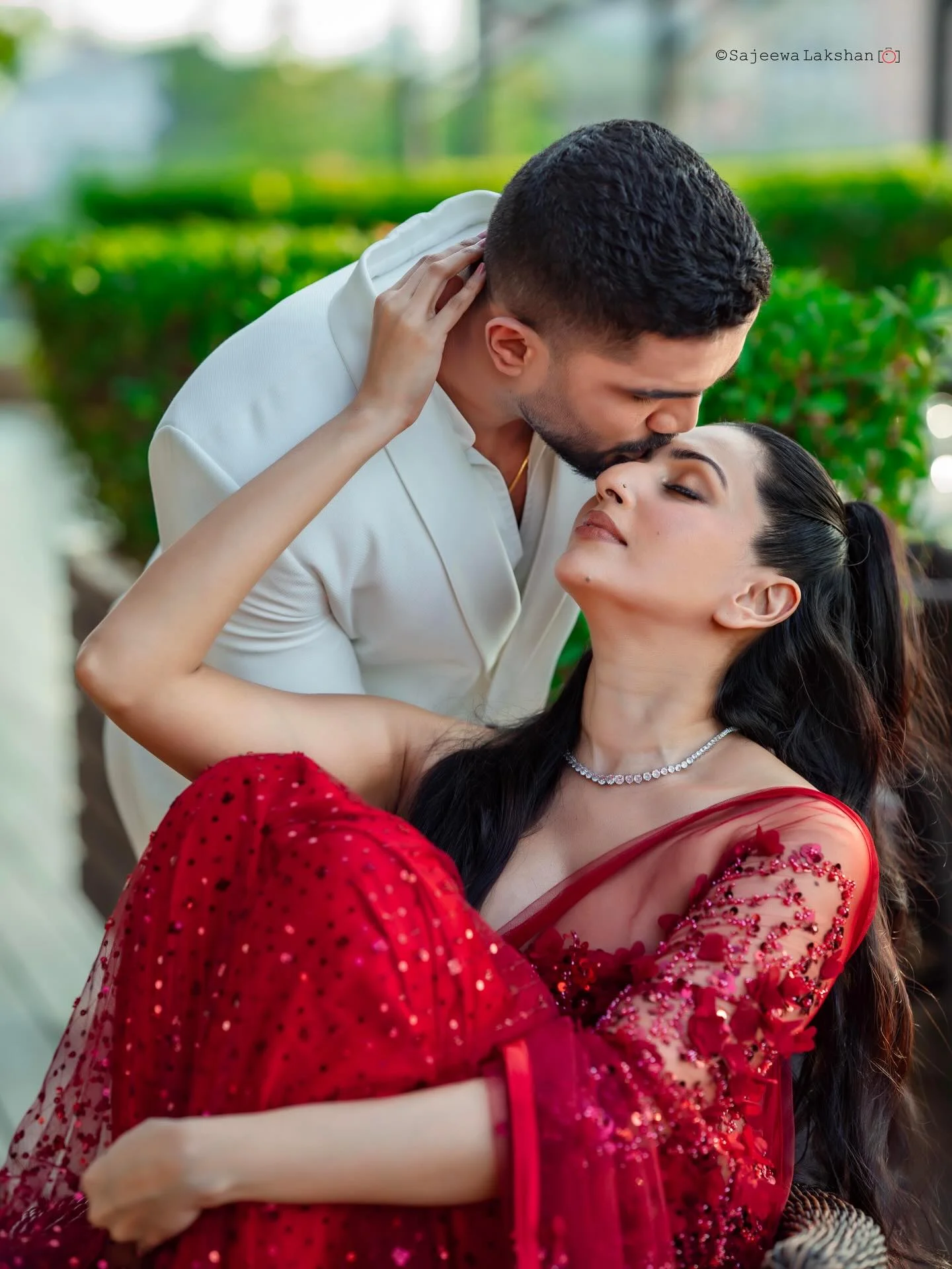 Photo by Amanda Silva on February 14, 2026. May be an image of one or more people, makeup, people kissing, dress, wedding, outdoors and text.