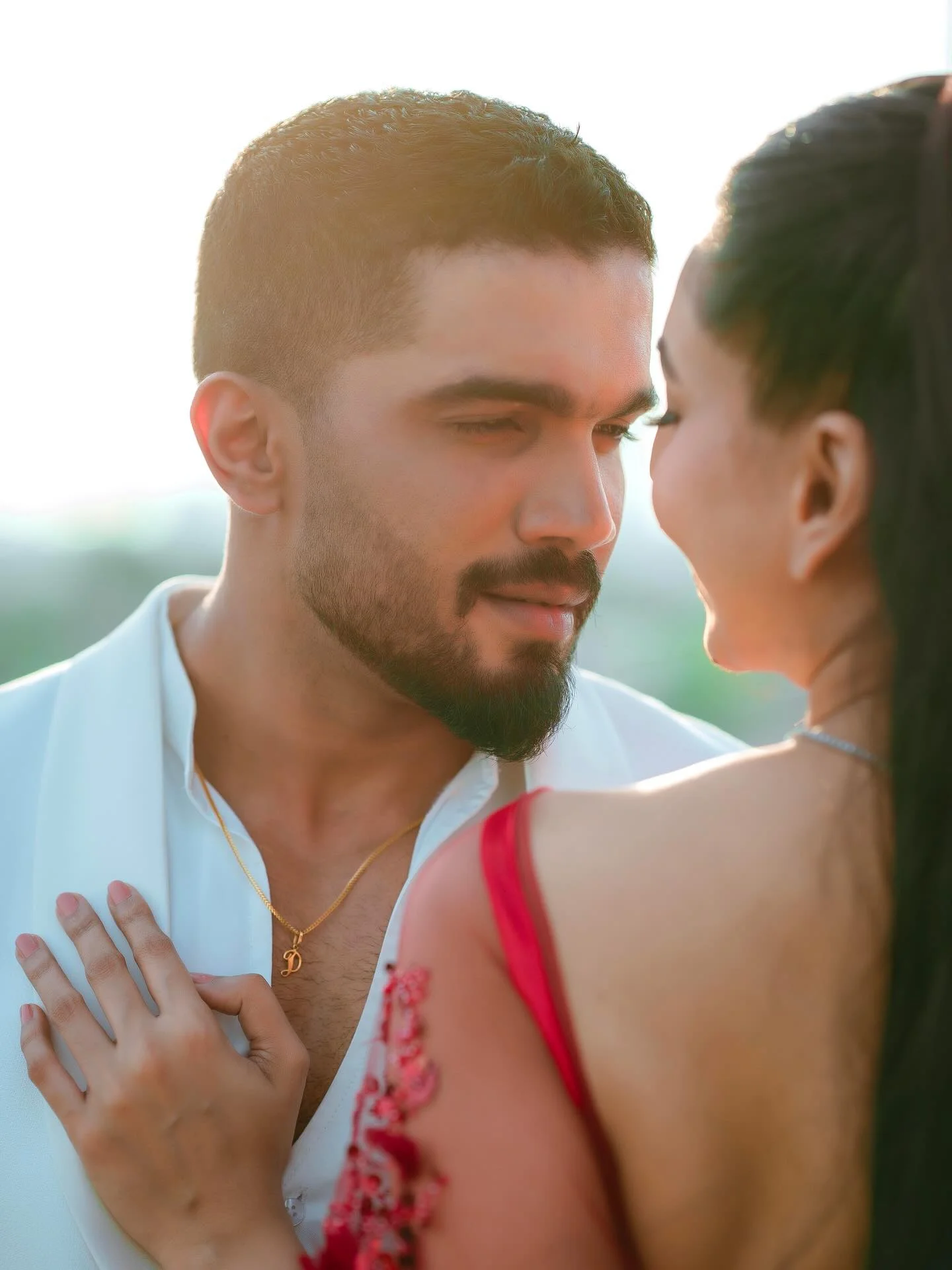 Photo by Amanda Silva on February 14, 2026. May be an image of one or more people, henna, beard, makeup, people kissing, dress, wedding, outdoors and text.