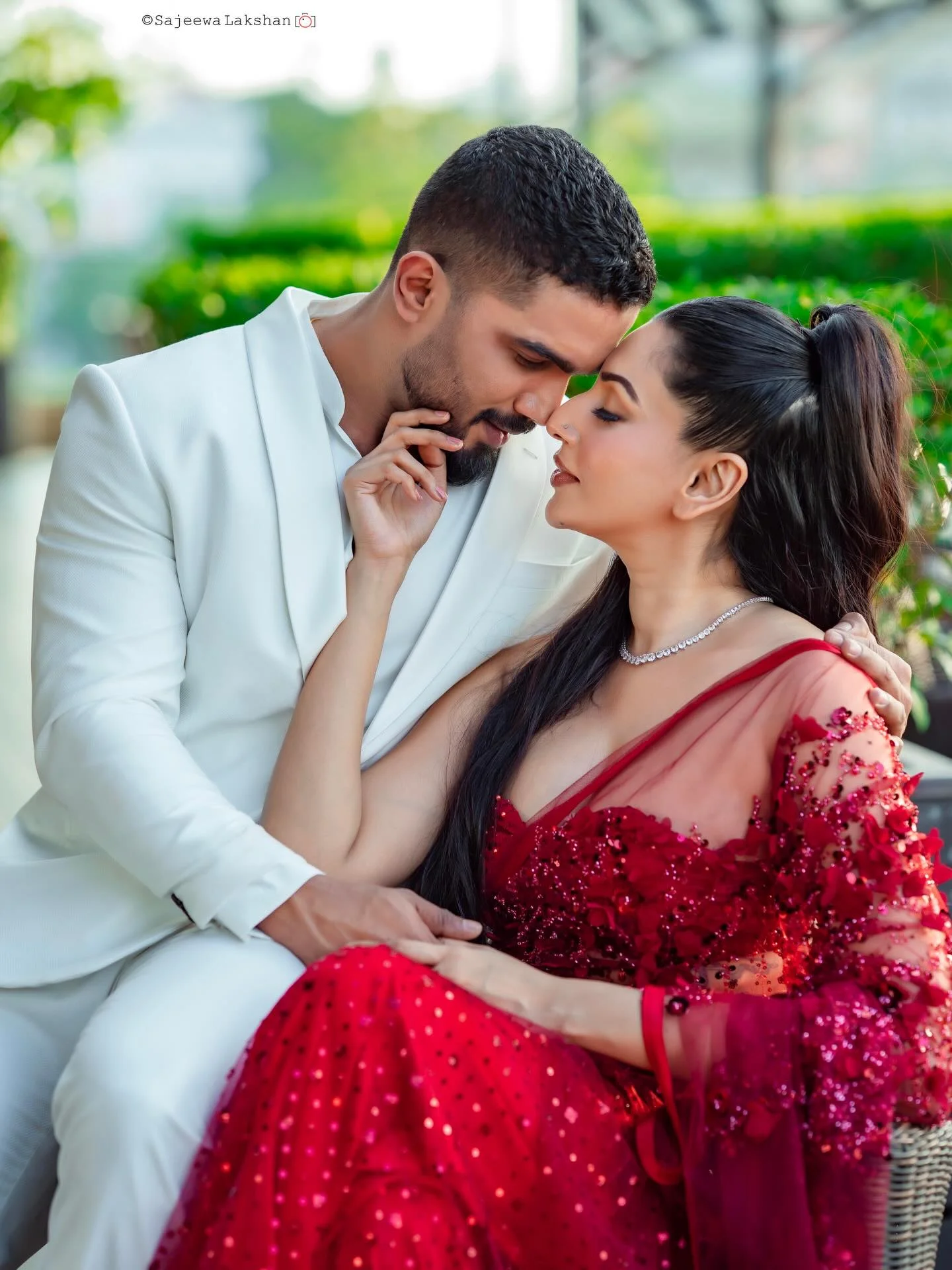 Photo by Amanda Silva on February 14, 2026. May be an image of one or more people, henna, makeup, people kissing, dress, wedding, outdoors and text.