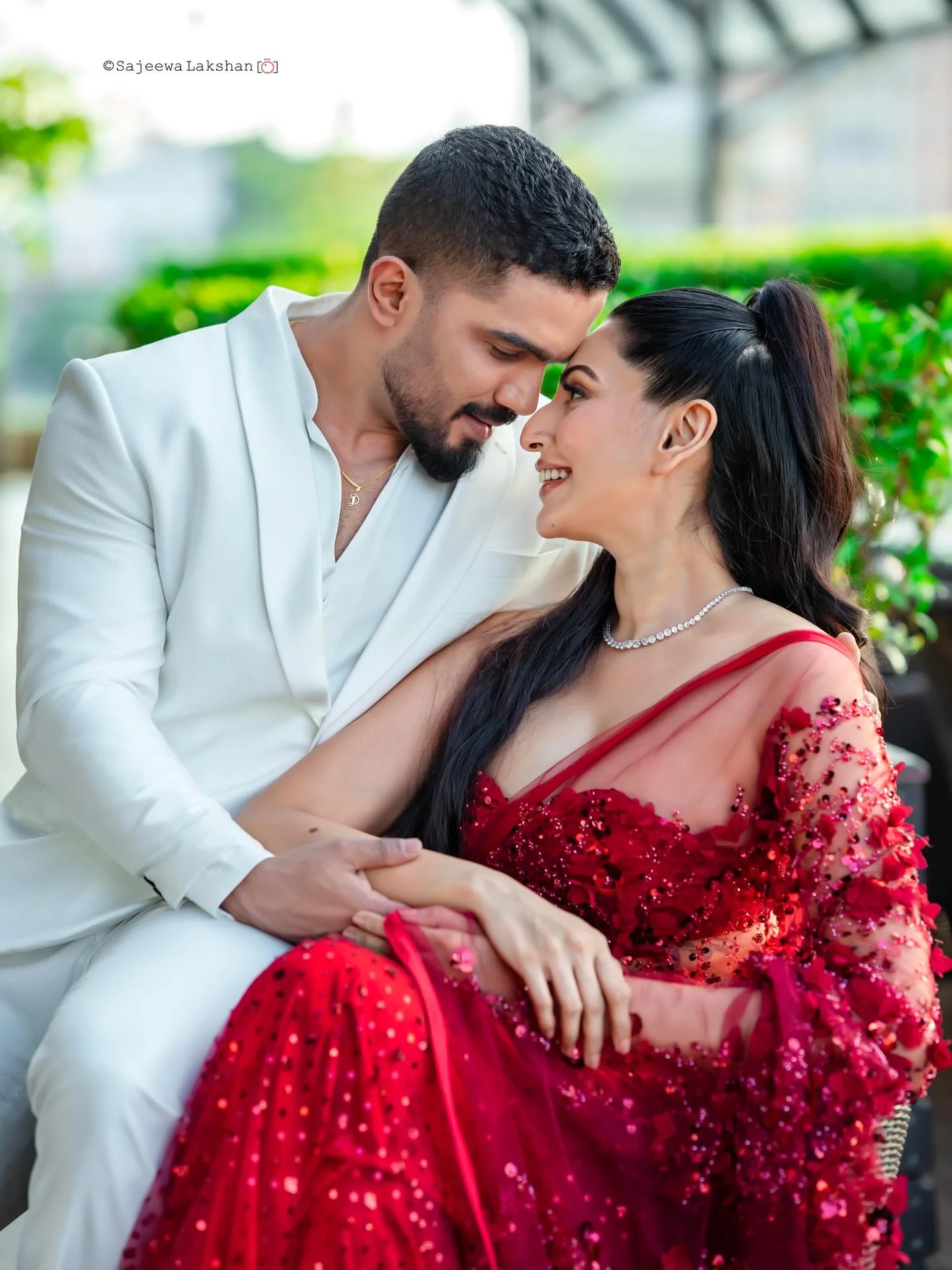 Photo by Amanda Silva on February 14, 2026. May be an image of one or more people, makeup, dress, dinner jacket, wedding, outdoors and text.